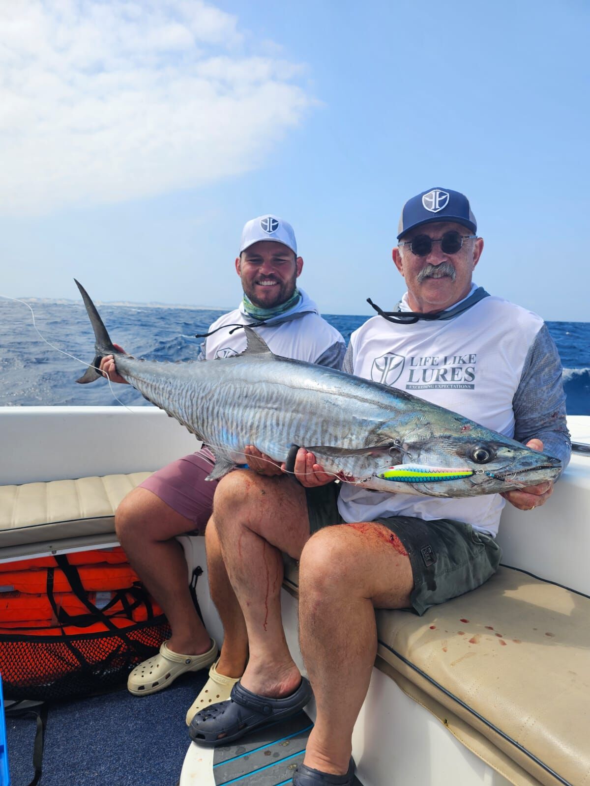 Two anglers with a king mackerel